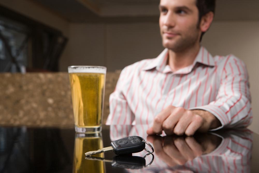 Hayes & Hayes Attorneys at Law | Rock Hill, SC | man a bar with a drink reaching for his car keys
