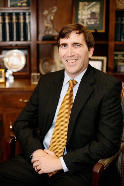 Hayes & Hayes Attorneys at Law | Rock Hill, SC | Attorney Creighton Hayes sitting in chair in his office
